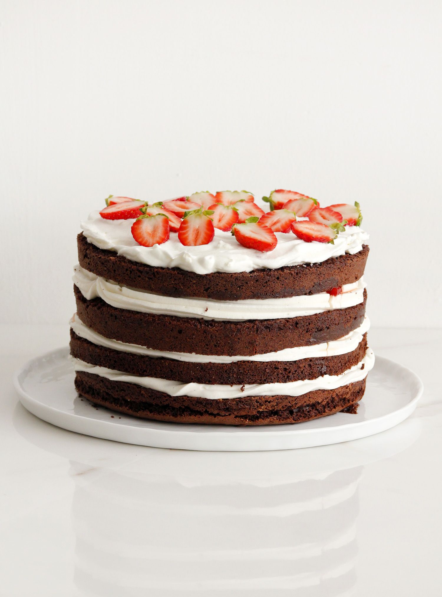 Sky-high Chocolate, Cream and Strawberry Layer Cake